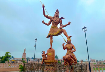 Wall Mural - a divine statue of shiva the god between the lake closeup shot