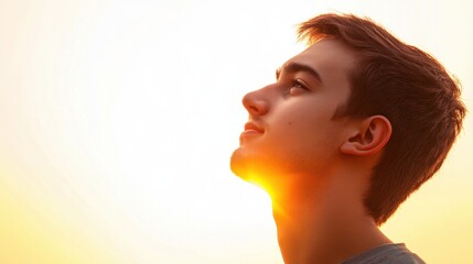 Wall Mural - An outline of a young man silhouette in profile, set starkly against a bright white background, capturing a moment of quiet reflection.