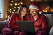 © Lilly - Man and woman in Christmas clothes buying online. Christmas atmosphere.