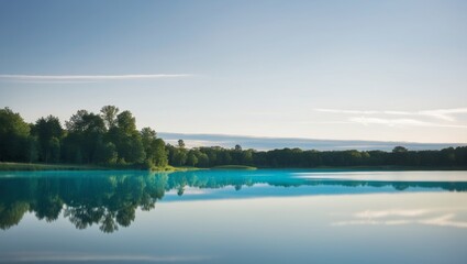 A serene lake scene with a clear blue surface and a white sky in the background.