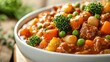 © Johannes - Soy goulash with stewed vegetables peas broccoli carrots and spices a nutritious vegan dish a source of protein closeup copy space