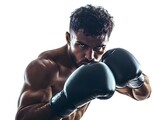 Determined boxer preparing for intense punch focused eyes studio lighting highlights strength