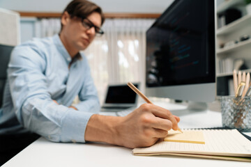 stressful it developer analyzing online software development information on pc and laptop with codin