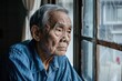 © shobakhul - An old man sits in a window looking out at the street, generative ai image