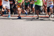 © tsuguliev - Children marathon runners crowd, young teen sportsmen participants start running in the city streets, crowd of kids joggers in motion, kid group athletes outdoor run, family competition in summer day