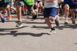 © tsuguliev - Children marathon runners crowd, young teen sportsmen participants start running in the city streets, crowd of kids joggers in motion, kid group athletes outdoor run, family competition in summer day