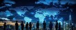 © Art_You - Silhouetted business people standing against a digital world map with blue lines connecting diverse cities, symbolizing global networking and international communication.