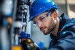 © Jacek - A professional plumber in a blue helmet and glasses.