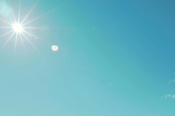 A person enjoying a hobby of flying a kite in a clear blue sky