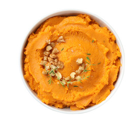 Wall Mural - Delicious mashed sweet potatoes and walnuts in bowl isolated on white, top view