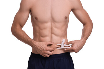 Poster - Man measuring body fat with caliper on white background, closeup