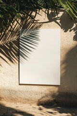 Poster - White blank poster on a beige concrete wall with palm shadows