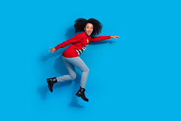 Poster - Photo of cheerful optimistic woman wear red stylish clothes store mall discount isolated on blue color background