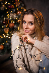 cute christmas girl with new year lights.