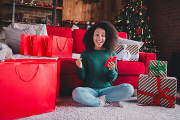 Wall Mural - Photo of funny cute girl sit floor x-mas preparation buy new year gifts bag package online magic time indoors