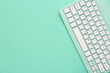 © Pixel-Shot - Green computer keyboard on green background. Top view