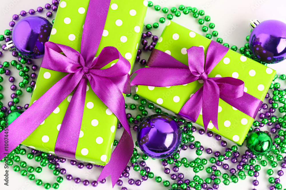 Composition with beautiful gift boxes and Christmas balls on white background, closeup