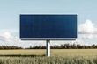 © JAKE STUDIO - Solar panel billboard in a green field under a clear blue sky.