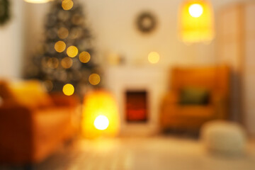 Sticker - Blurred view of living room with fireplace, Christmas tree and glowing lamps in evening