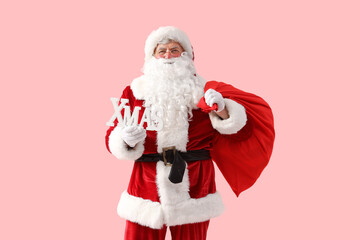 Canvas Print - Santa Claus with Christmas bag and word XMAS on pink background