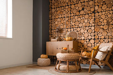 Canvas Print - Cozy armchair, pumpkins, coffee table and wooden chest of drawers in autumn interior of living room