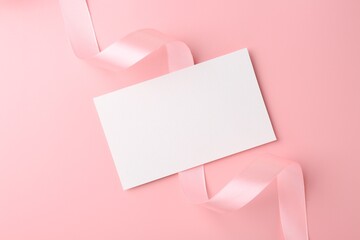 Sticker - Blank card and ribbon on pink background, top view