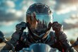 © Boomanoid - Motorcycle rider wearing helmet and gloves at sunset