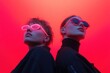 © Papukos - Two fashion models posing with futuristic sunglasses and red backdrop