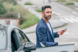 © carballo - businessman with car and mobile phone