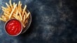 © ElenaX - Crispy golden french fries with ketchup on dark background