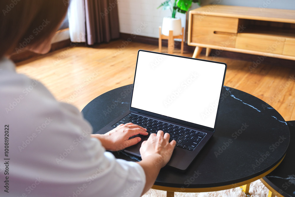 Mockup image of a woman using and typing on computer laptop with blank ...