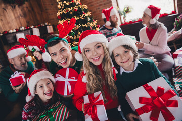 Wall Mural - Portrait of big peaceful family toothy smile hold giftbox festive christmas time together flat indoors