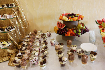 Wall Mural - Cakes, mousses and fruits on the buffet table.