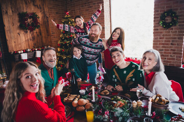 Canvas Print - Photo of group family members sit festive table have fun gather celebrate christmas apartment indoors