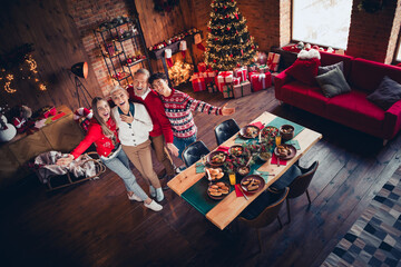 Canvas Print - High angle view full size photo of peaceful family have fun laugh celebrate festive christmas tree illumination time apartment indoors