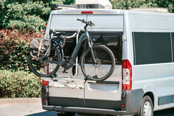 Rear view of camper van with bike