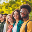 © Hamza - Group of Diverse Friends Enjoying a Sunny Day in the Park Multi-Ethnic Smiling Young Adults