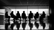 © MikaCreative - Group of Professionals in Silhouette Discussion Setting