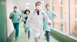 © My Ocean studio - A group of masked healthcare professionals, including doctors and nurses, running urgently through a hospital hallway. Ideal for emergency response, teamwork, and medical crisis management themes.
