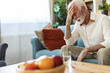 © Jelena Stanojkovic - Senior man, pain and headache in home with retirement crisis, brain fog and stress for mistake. Elderly man, migraine and vertigo with frustrated for mental health, fatigue and anxiety for trauma.