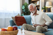 © Jelena Stanojkovic - Upset senior elder man feel sudden back pain muscles ache tension injury sitting at home, sad old grandfather touching spine having lower lumbago backache osteoarthritis arthritis, backache concept.
