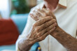 © Jelena Stanojkovic - Home, hands and senior man with wrist pain for injury, inflammation and discomfort of carpal tunnel. House, male person and ache with massage for relief, osteoporosis and arthritis symptoms.
