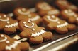 © MrHamster - Close-up of a gingerbread man cookie with white icing on a baking sheet