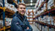 © Photolife   - portrait of a Caucasian employee of a logistics center against the background of shelves with boxes of products and parcels