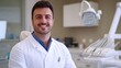 © Maria - Male dentist smiling in dental clinic. Dentistry concept, healthy white teeth. Dentist in office.
