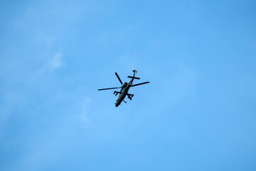 Silhouette Helicopter flying on mid-air isolated white background