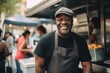 © NikoG - Smiling portrait of a middle aged African American male food truck worker