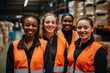 © NikoG - Smiling portrait of a young and diverse group of female warehouse workers