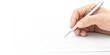 © peacefy - A hand holding a pen poised over a blank sheet of paper, suggesting the start of writing or creative expression.