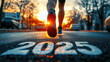 © SOUHAIL - New year 2025 or start straight concept, word 2025 written on the asphalt road and athlete running preparing for new year at sunset, goals and plans for the next year